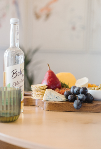 charcuterie board with drink 